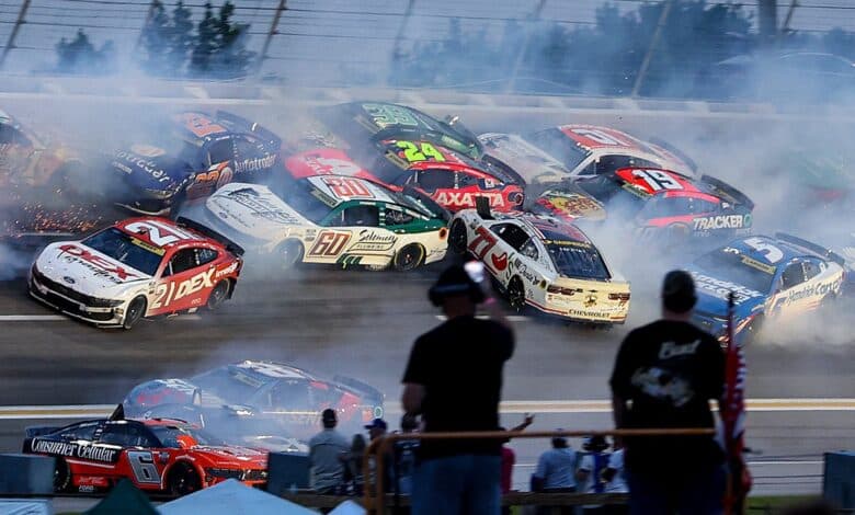 NASCAR halts Atlanta Cup race after huge crash collects half the field