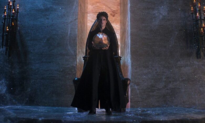 Morpheus the Endless Lord of the Dreaming, standing in black robes while holding a talisman