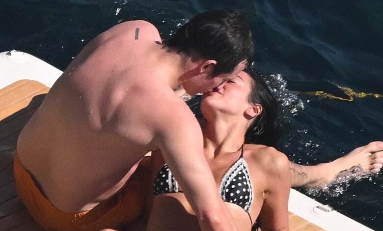 Dua Lipa and fiancé Callum Turner can't keep their hands off each other as they share a passionate kiss during romantic Amalfi Coast getaway