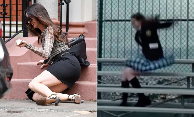 Anne Hathaway with a smile, after falling down the steps while filming "The Devil Wears Prada 2" in New York.; Anne Hathaway in