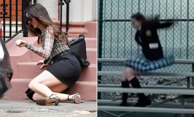 Anne Hathaway with a smile, after falling down the steps while filming "The Devil Wears Prada 2" in New York.; Anne Hathaway in